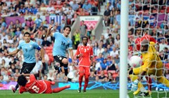 Luis Suarez stigao u Liverpool i potpisao novi ugovor